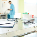 A clean and well-equipped examination room at a veterinary clinic in Bowmanville, featuring medical tools and test samples.